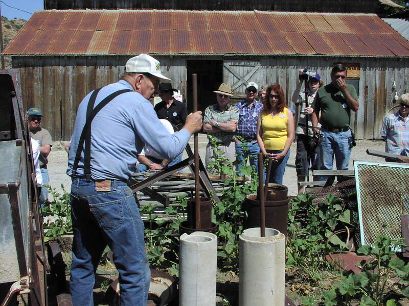 Ray demonstrating how the concrete pipes were constructed for bringing water to the ranch.
